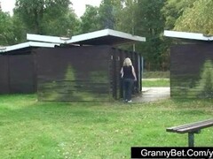 Old blonde is banged by young guy outdoors Thumb